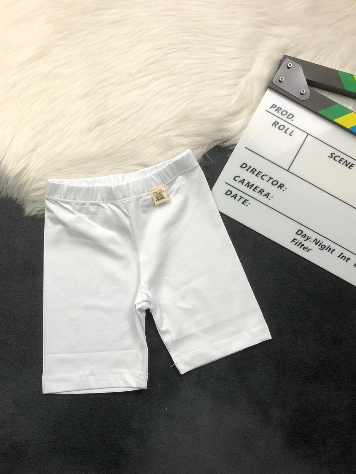The Nile Luxuries white cotton blend children's bike shorts with elastic waistband for comfort and movement.