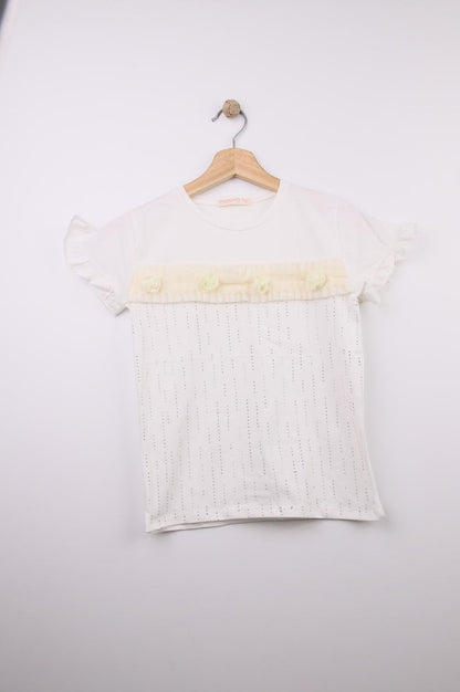 The Nile Luxuries white cotton t-shirt with ruffled sleeves, floral embellishments, and perforated stripes.