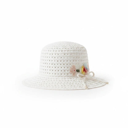 The Nile Luxuries white straw sun hat for toddlers featuring a delicate floral accent and a decorative ribbon bow.