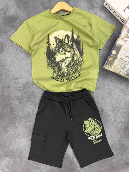 The Nile Luxuries boys two-piece set with olive green wolf graphic t-shirt and black cargo shorts with drawstring.