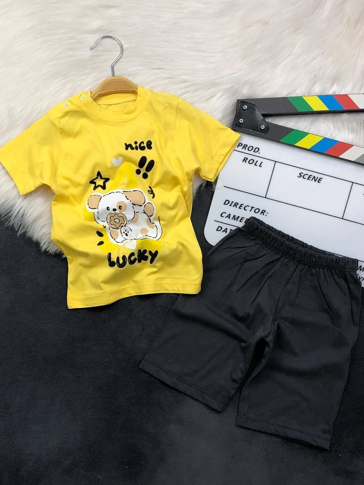 The Nile Luxuries toddler yellow t-shirt with puppy graphic and black shorts set with elastic waistband