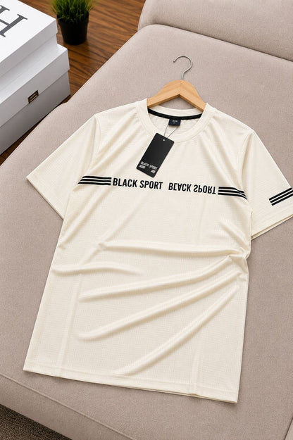 The Nile Luxuries cream athletic t-shirt with black graphic stripes and text detail. Short sleeves, crew neck.