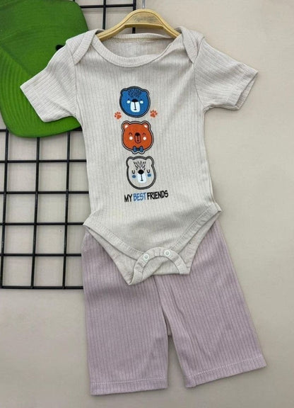 The Nile Luxuries baby bodysuit and shorts set in ribbed knit. Features three stacked bears graphic and "MY BEST FRIENDS" text. Light beige bodysuit with lavender shorts.