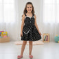The Nile Luxuries girls black heart print sundress with lace trim and matching purse. Sleeveless with adjustable straps.