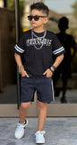 The Nile Luxuries boys' dark wash denim shorts with white side stripes and elastic drawstring waist.