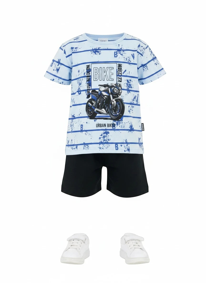 The Nile Luxuries Boys light blue graphic print t-shirt with black shorts, featuring a motorcycle design and horizontal stripes.