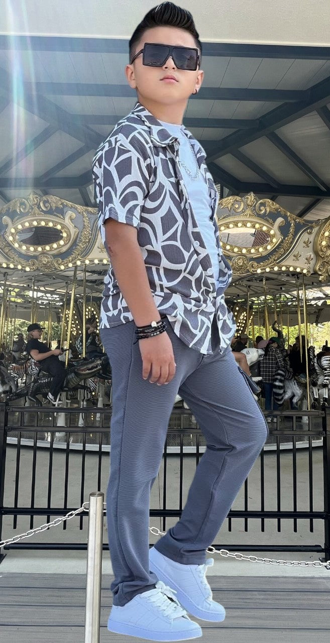 The Nile Luxuries boys' grey cargo pants and abstract print short sleeve shirt set. Comfortable elastic waist pants.
