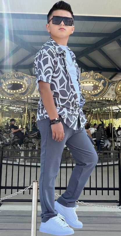 The Nile Luxuries boys' grey cargo pants and abstract print short sleeve shirt set. Comfortable elastic waist pants.