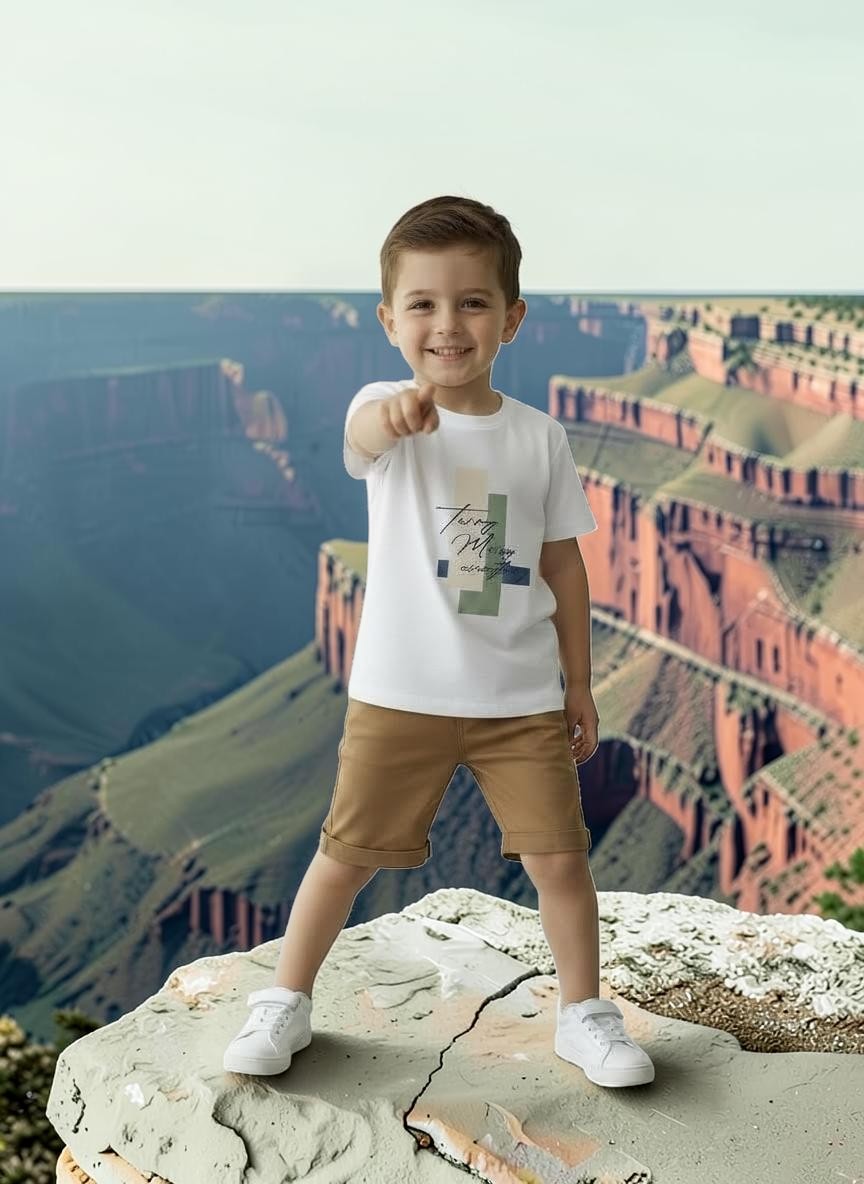 The Nile Luxuries boys white cotton t-shirt with graphic print and tan shorts set. Short sleeves, relaxed fit.