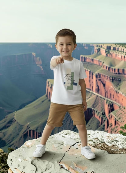 The Nile Luxuries boys white cotton t-shirt with graphic print and tan shorts set. Short sleeves, relaxed fit.