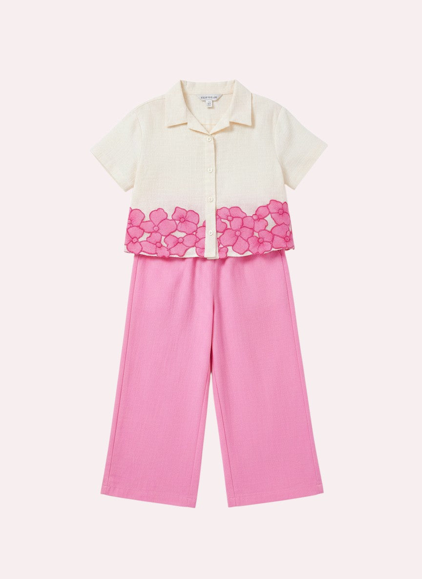 The Nile Luxuries girls' cream cropped shirt with floral embroidery and pink wide-leg pants set.