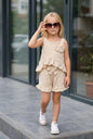 The Nile Luxuries Girls beige polka dot cotton blend shorts set with ruffle trim and floral applique.