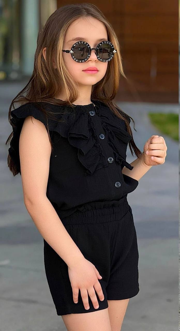 The Nile Luxuries girls' black cotton gauze ruffled button-front top and elastic waist shorts set.