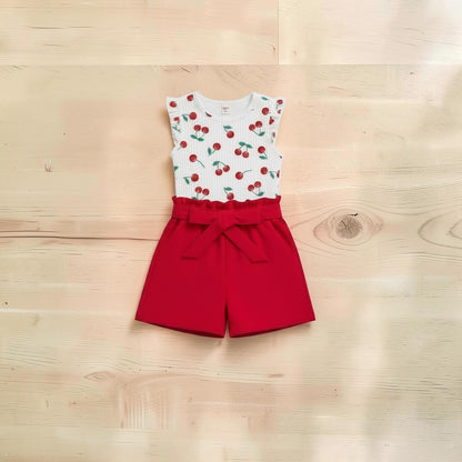 The Nile Luxuries Girls white cherry print top with ruffle sleeves and red paperbag shorts set.