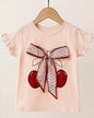The Nile Luxuries girls peach cotton t-shirt with cherry graphic and floral bow, ruffled sleeves.