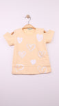 The Nile Luxuries girls pastel yellow cold-shoulder t-shirt with assorted heart prints and subtle sparkle detail.