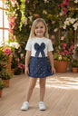 The Nile Luxuries girls blue denim A-line skirt with pearl embellishments and pleats.