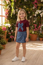 The Nile Luxuries girls blue denim skirt with pearl embellishments and pleats. A-line silhouette, adjustable waistband.