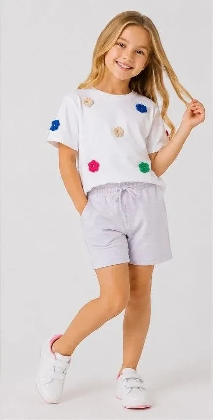 The Nile Luxuries girls' white cotton t-shirt with floral appliques and lavender jersey shorts set.