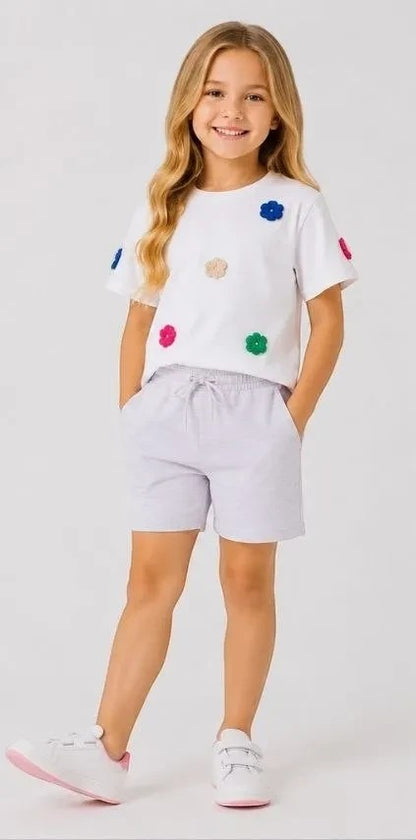 The Nile Luxuries girls' white cotton t-shirt with colorful floral appliques and lavender jersey shorts set.