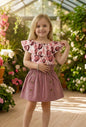 The Nile Luxuries Girls' floral print off-shoulder top with ruffled sleeves and button-front skirt in rose pink.