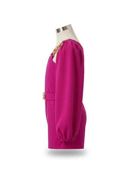 The Nile Luxuries Girls one shoulder puff sleeve romper in fuchsia with gold chain detail and belt.