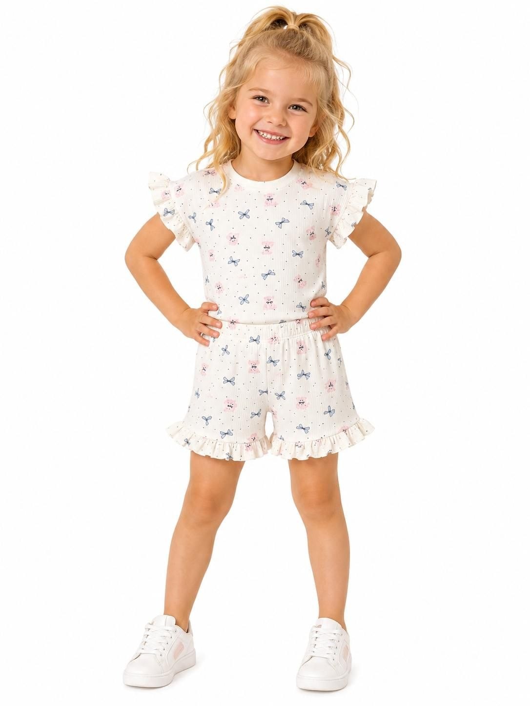 The Nile Luxuries girls' ivory ribbed knit set with teddy bear and bow print, ruffled sleeves and shorts.