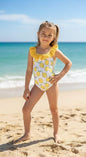 The Nile Luxuries girls' white one-piece swimsuit with yellow lemon print and ruffled neckline. Stretchy fabric.