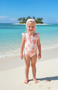 The Nile Luxuries girls' peach and daisy print swimsuit with ruffle sleeves and matching bonnet.