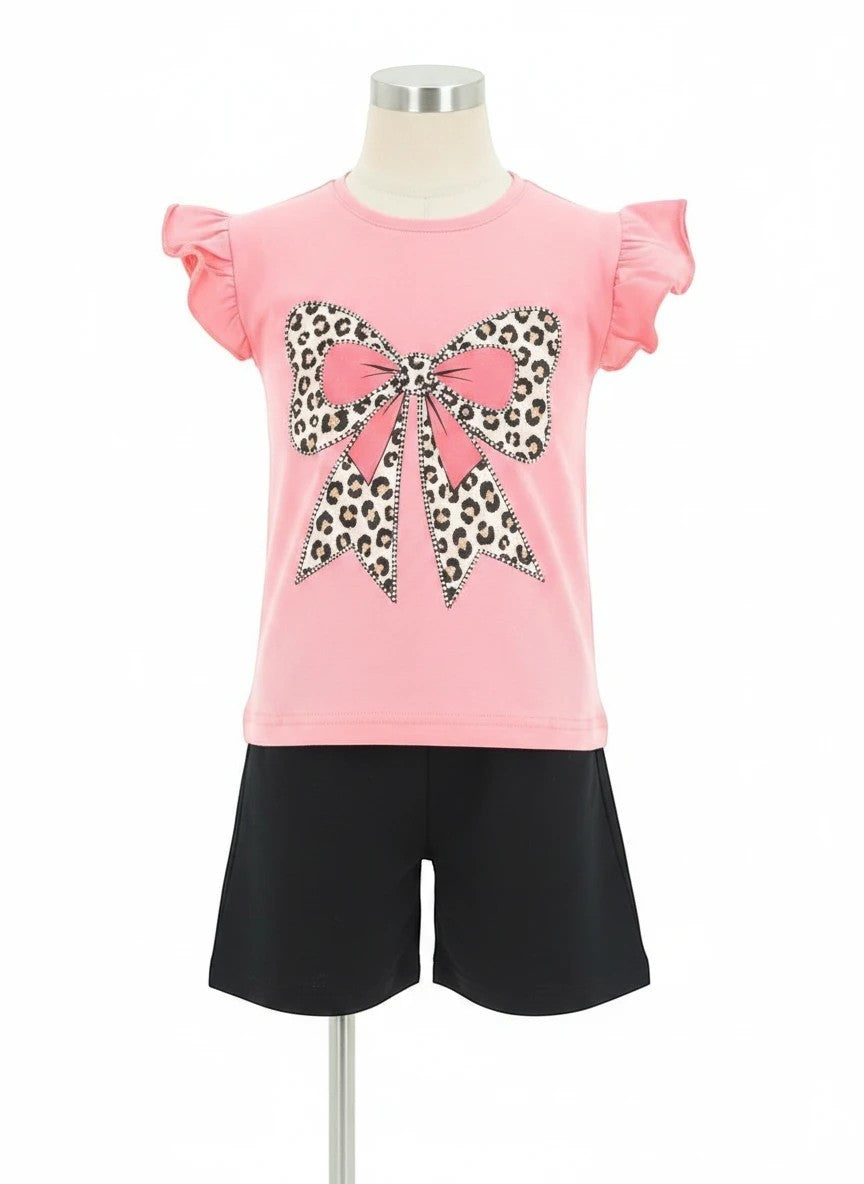 The Nile Luxuries girls pink t-shirt with leopard bow graphic and ruffled sleeves, paired with black shorts.