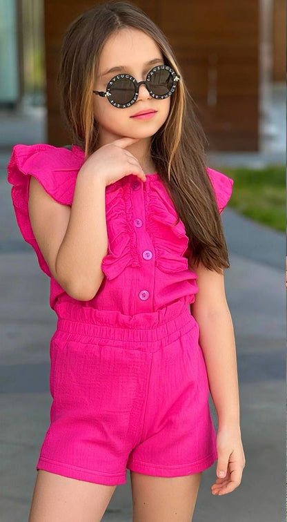 The Nile Luxuries girls' bright pink ruffled button-front top and elastic waist shorts set, made from cotton gauze.