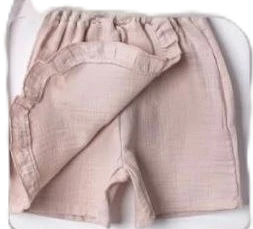 The Nile Luxuries girls' pink ruffled cotton skirt with elastic waistband and wrap-around design.
