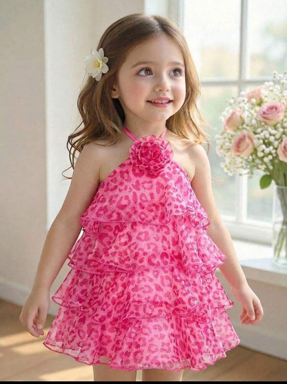 The Nile Luxuries girls' pink tiered ruffle halter neck dress with floral print and fabric flower accent.