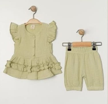The Nile Luxuries girls light green cotton gauze ruffle sleeve top and shorts set. Eyelet details and flutter sleeves on top.