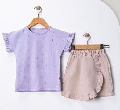 The Nile Luxuries girls' lavender cotton t-shirt with ruffled sleeves and a beige wrap skirt with ruffled trim.