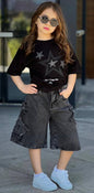 The Nile Luxuries girls black t-shirt with star print and distressed denim shorts with star cutouts.