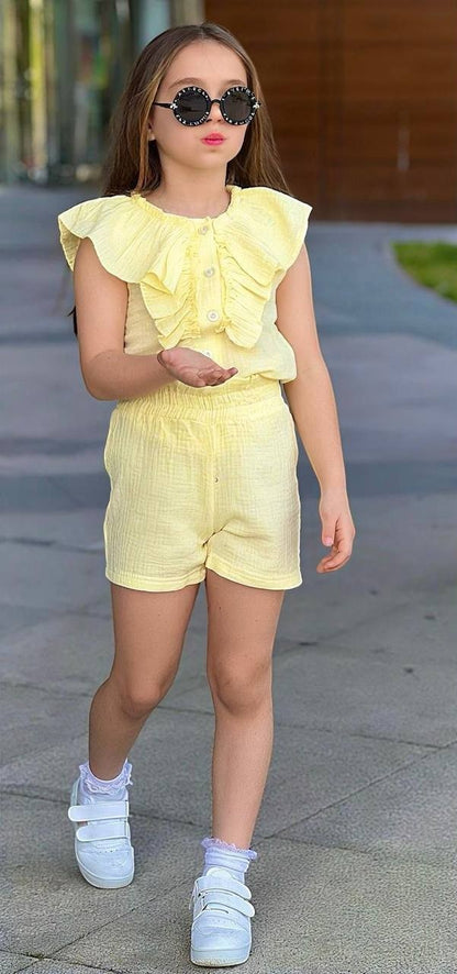 The Nile Luxuries girls' yellow cotton gauze ruffled button-front top and elastic waist shorts set.