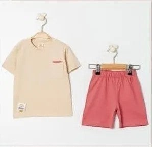 The Nile Luxuries children's beige t-shirt with chest pocket and coral pink shorts set, short-sleeved, elastic waist, soft fabric.