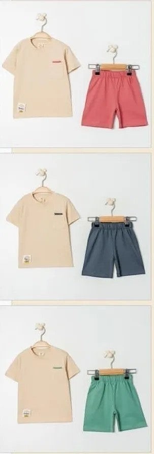 The Nile Luxuries children's beige t-shirt with pocket and coral pink shorts set. Soft fabric, elastic waistband.