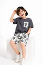 The Nile Luxuries boys' dark grey t-shirt with leaf print pocket and matching leaf print shorts.