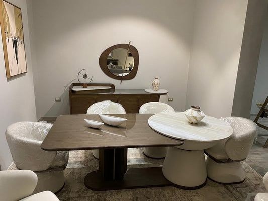 The Nile Luxuries modern dining set with dark wood table, marble top table, and upholstered chairs.