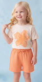 The Nile Luxuries cream t-shirt with orange hibiscus graphic and matching orange gauze shorts with drawstring waist.