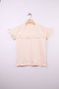The Nile Luxuries peach cotton t-shirt with ruffled sleeves, floral embellishments, and perforated stripes.