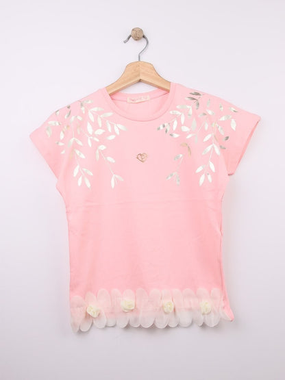 The Nile Luxuries pink cotton t-shirt with metallic leaf print, gold heart emblem, and ruffled hem with fabric roses.