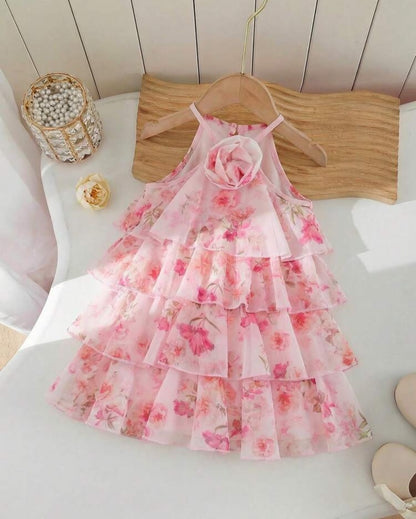 The Nile Luxuries girls' pink floral chiffon tiered ruffle halter neck dress with fabric flower accent.