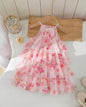 The Nile Luxuries girls' pink floral chiffon tiered ruffle halter neck dress with fabric flower accent.