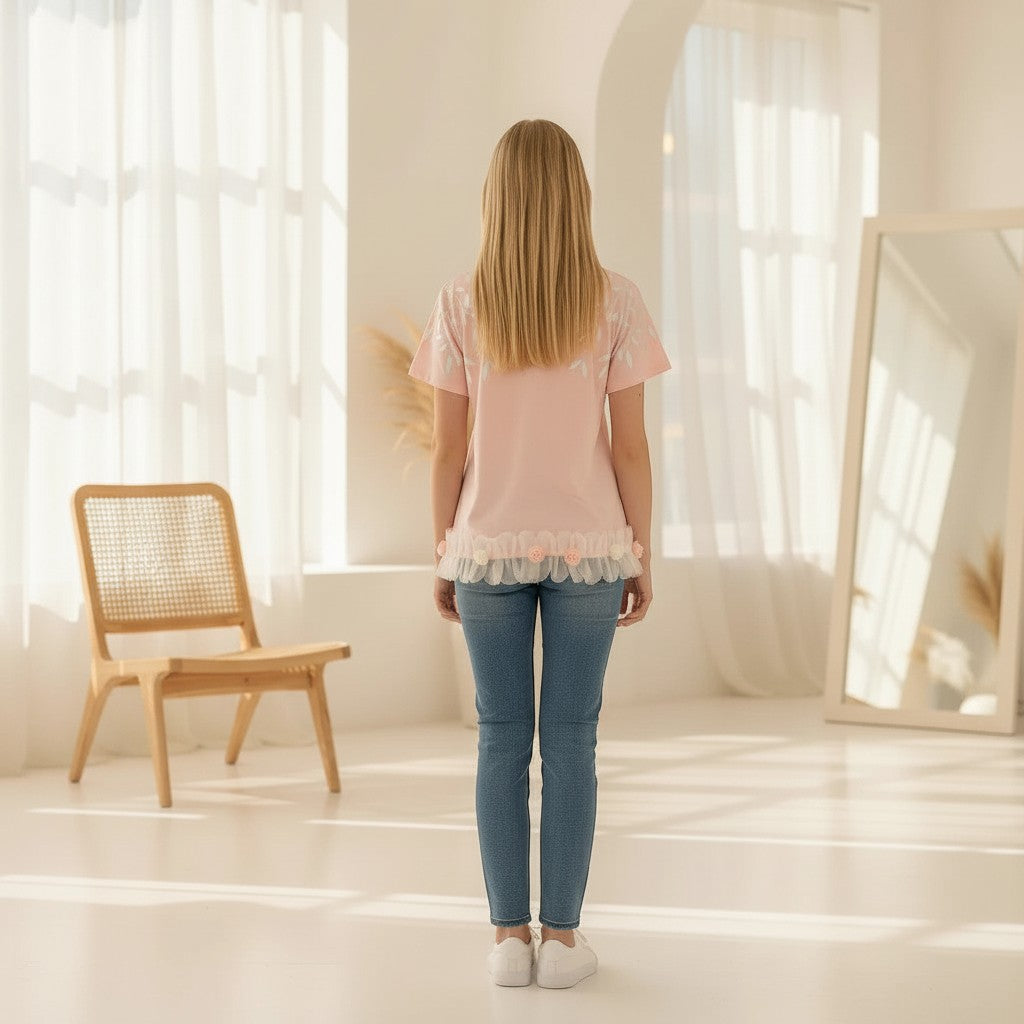 The Nile Luxuries light pink t-shirt with leaf print and ruffle hem adorned with flowers.