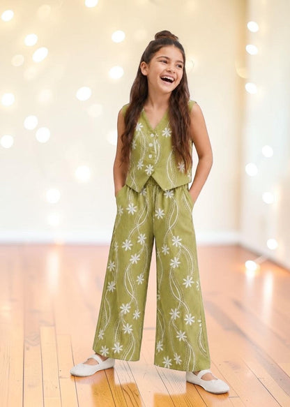 The Nile Luxuries sage green linen-blend vest and wide-leg pants set with white floral embroidery. Sleeveless V-neck vest with button front.