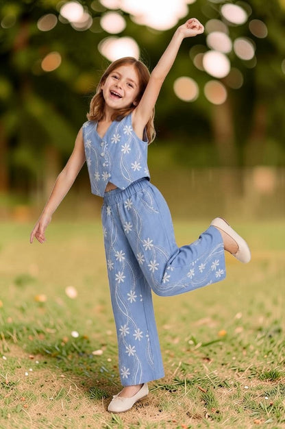 The Nile Luxuries sky blue linen-blend sleeveless vest and wide leg pants set with white floral embroidery.