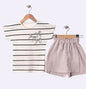 The Nile Luxuries striped t-shirt with bow detail and matching blush pink shorts. Cotton set for kids.